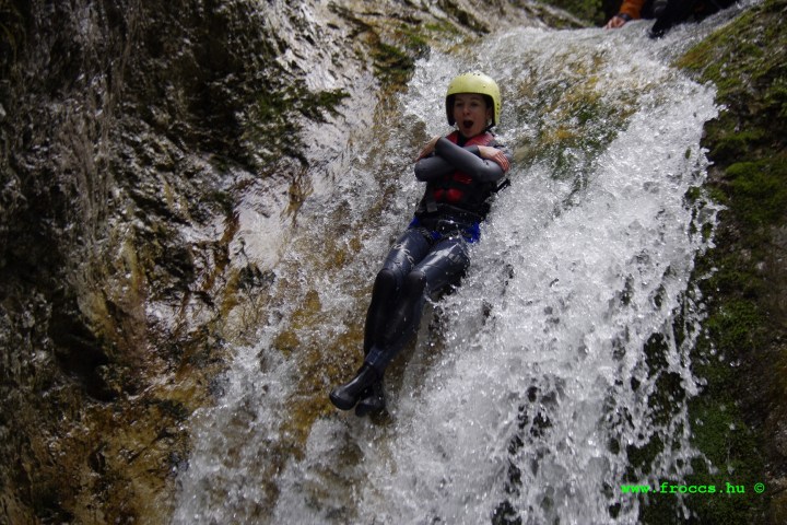 a man riding on the back of a waterfall