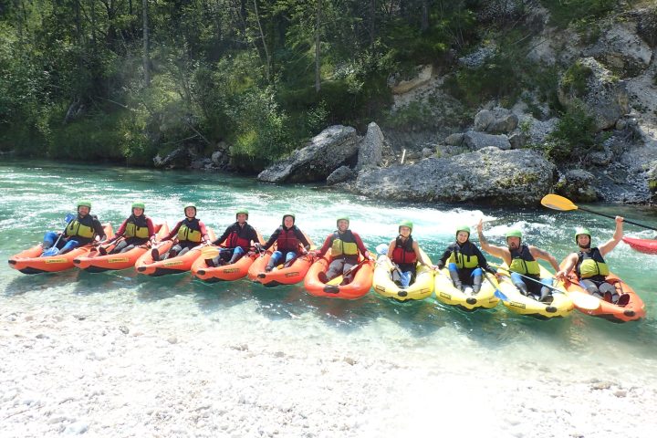 a group of people on a boat in the water