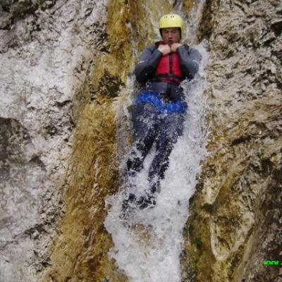 a man riding on top of a rock