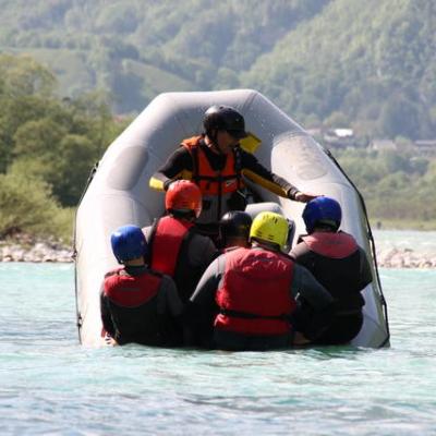 a man riding on a raft in a body of water