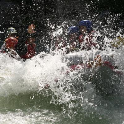 a man riding a wave on a surfboard in the water