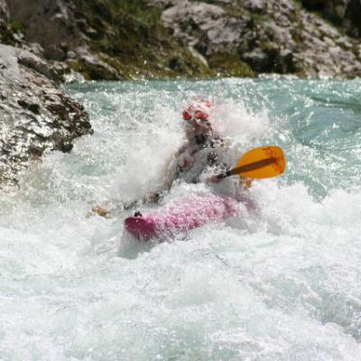 a man riding a wave on a surfboard in the water